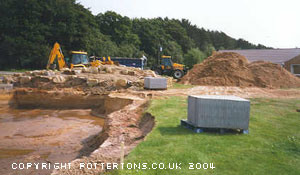 Pondtractorsclearingsand